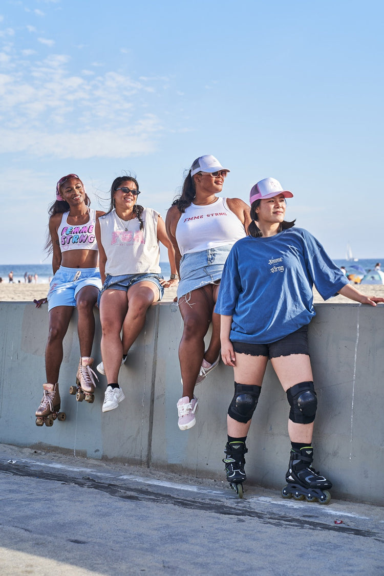 Four Fmme Strng models with roller blades and roller skates at Venice Beach
