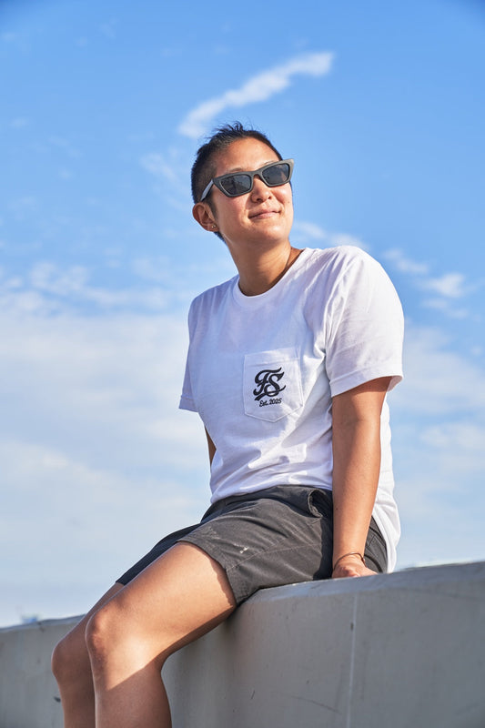 Model wearing the white FS Est. 2025 Pocket Tee at Venice Beach
