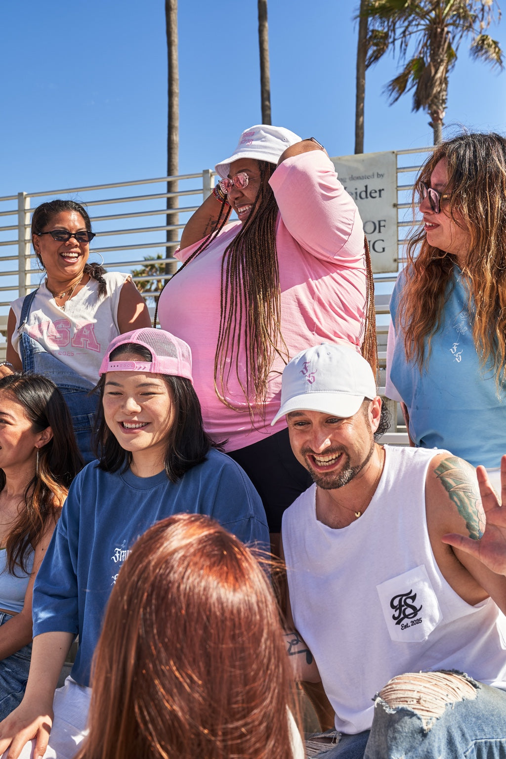 Fmme Strng community wearing Varsity apparel at Venice Beach