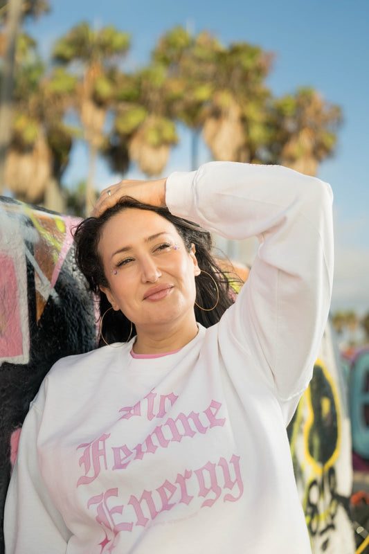 Woman wearing the Fmme Strng "Big Femme Energy" crewneck at Venice Beach
